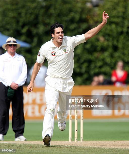 Mitchell Johnson of Australia celebrates Tim Southee of New Zealand being caught out during day three of the First Test match between New Zealand and...