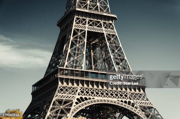 close-up of eiffel tower, paris, france - eiffel stock-fotos und bilder