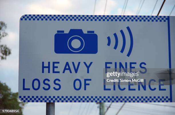 'heavy fines: loss of licence' speed camera sign - nsw police stock pictures, royalty-free photos & images