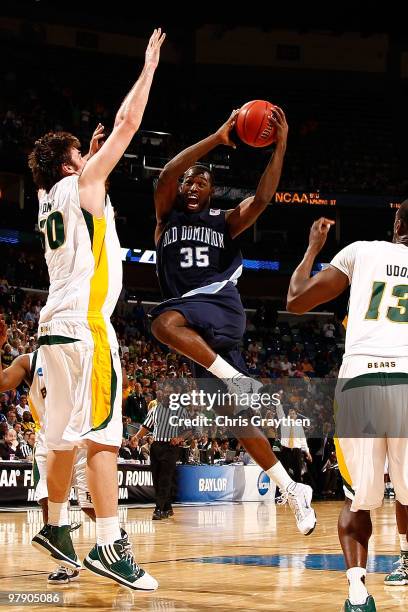 Ben Finney of the Old Dominion University Monarchs shoots the ball over Josh Lomers of the Baylor Bears during the second round of the 2010 NCAA...