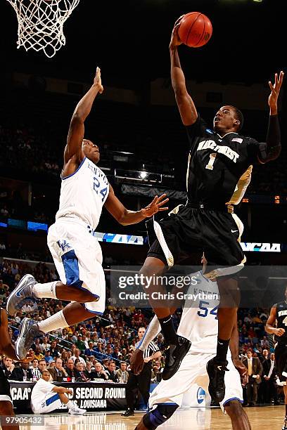 Al-Farouq Aminu of the Wake Forest Demon Deacons makes a shot over Eric Bledsoe of the Kentucky Wildcats during the second round of the 2010 NCAA...