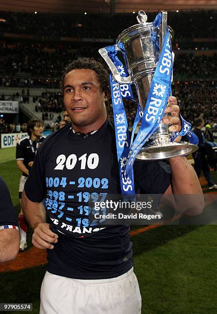 Thierry Dusautoir of France lifts the trophy after France completed the Grand Slam during the RBS Six Nations Championship match between France and...