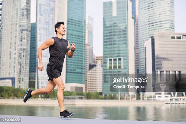 running a and training in singapore - southeast stock pictures, royalty-free photos & images