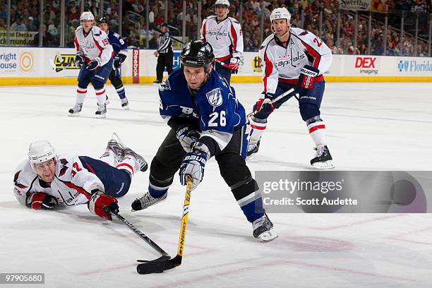 Martin St. Louis of the Tampa Bay Lightning controls the puck against Mike Green of the Washington Capitals during the first period at the St. Pete...