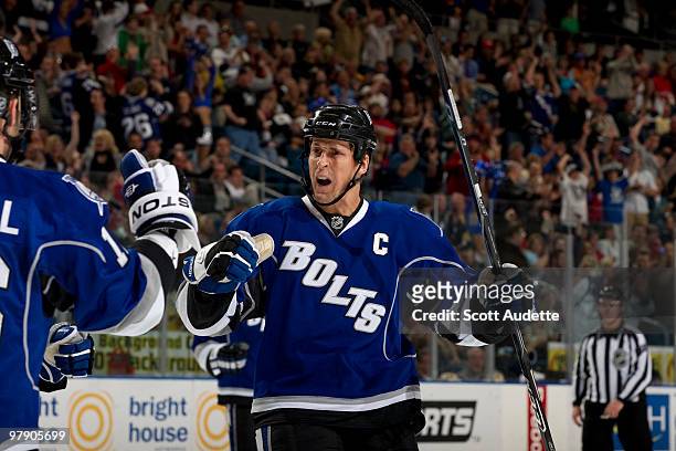 Vincent Lecavalier of the Tampa Bay Lightning celebrates a goal with teammates during the first period against the Washington Capitals at the St....
