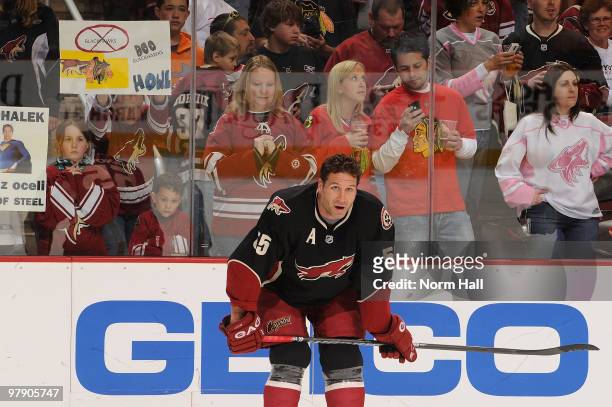 Ed Jovanovski of the Phoenix Coyotes warms up as fans of the Coyotes and Chicago Blackhawks look on on March 20, 2010 at Jobing.com Arena in...