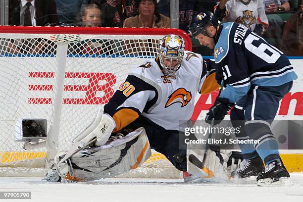 Goaltender Ryan Miller of the Buffalo Sabres blocks a shot by Cory Stillman of the Florida Panthers at the BankAtlantic Center on March 20, 2010 in...