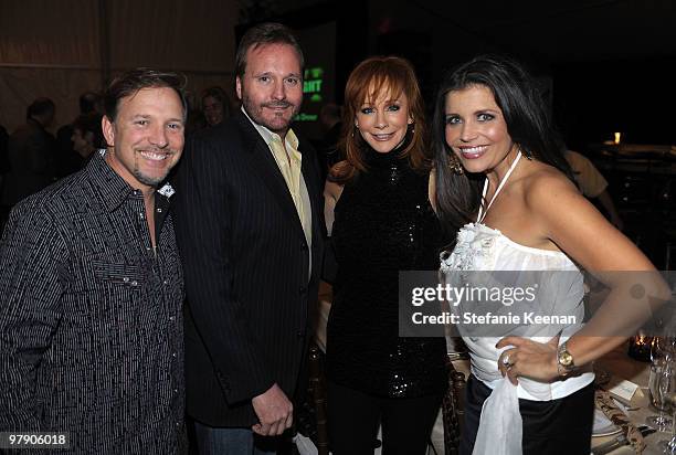 Glenn Stearns and Mindy Stearns pose Narvel Blackstock and Reba McEntire at the Celebrity Fight Night XVI Founder's Dinner held at JW Marriott Desert...