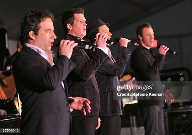Singers Remigio Pereira, Clifton Murray, Victor Micallef, and Fraser Walters of The Canadian Tenors perform onstage during the Celebrity Fight Night...