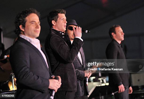 Singers Remigio Pereira, Clifton Murray, Victor Micallef, and Fraser Walters of The Canadian Tenors perform onstage during the Celebrity Fight Night...