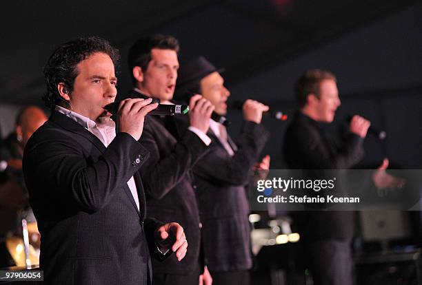 Singers Remigio Pereira, Clifton Murray, Victor Micallef, and Fraser Walters of The Canadian Tenors perform onstage during the Celebrity Fight Night...