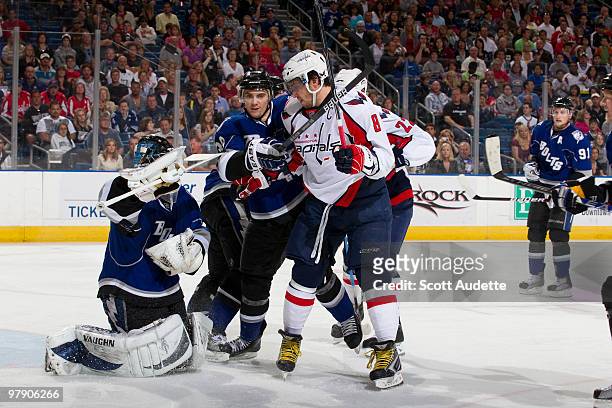 Antero Niittymaki of the Tampa Bay Lightning protects the puck as Alex Ovechkin of the Washington Capitals looks for a rebound at the St. Pete Times...