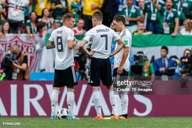 Toni Kroos of Germany, Julian Draxler of Germany and Mesut Oezil of Germany gestures during the 2018 FIFA World Cup Russia group F match between...