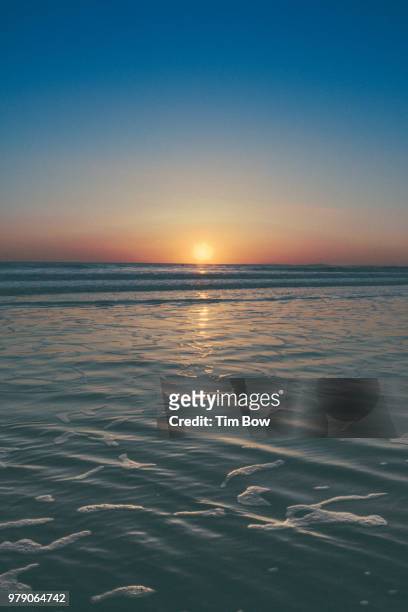 sunset over sea, porthcawl, wales - south glamorgan stock-fotos und bilder