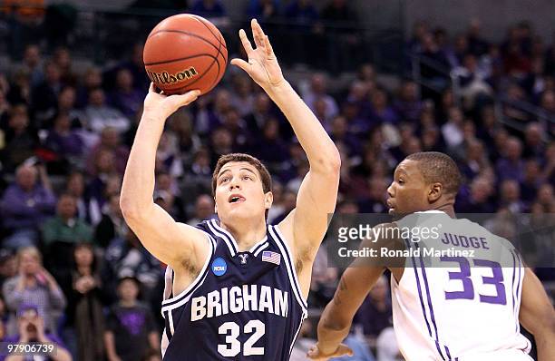 Jimmer Fredette of the Brigham Young Cougars attempts a shot against Wally Judge of the Kansas State Wildcats during the second round of the 2010...