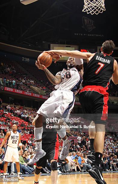 Terrence Williams of the New Jersey Nets shoots against Andrea Bargnani of the Toronto Raptors on March 20, 2010 at the IZOD Center in East...