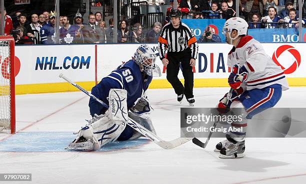 Jonas Gustavsson of the Toronto Maple Leafs stops the shoot out attempt of Brian Gionta of the Montreal Canadiens during game action March 20, 2010...