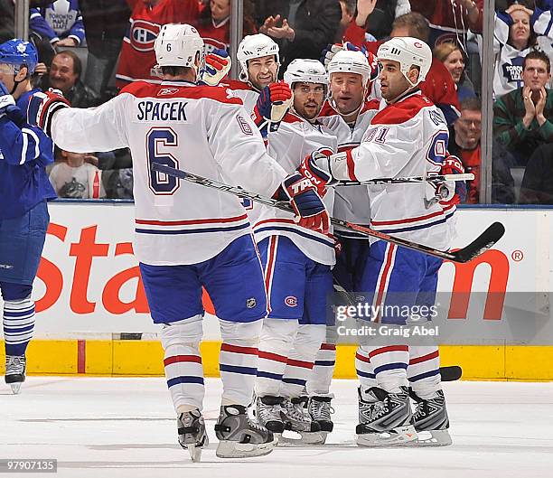 Jaroslav Spacek of the Montreal Canadiens celebrates a third period goal against the Toronto Maple Leafs during game action March 20, 2010 at the Air...