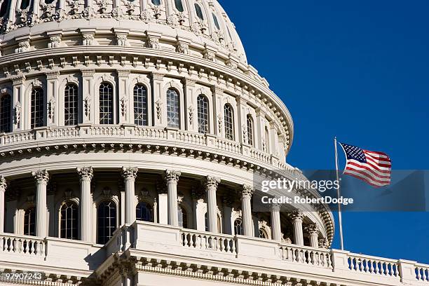 american flag and the u.s. capitol dome - the u s capitol in washington dc stock pictures, royalty-free photos & images