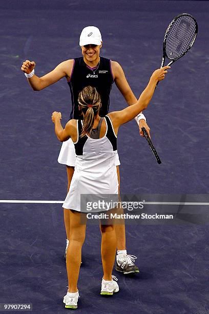 Kveta Peschke of the Czech Republic and Katarina Srebotnik of Slovakia celebrtate match point against Samantha Stosur and Nadia Petrova of Russia in...