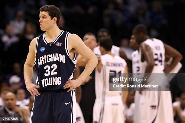 Jimmer Fredette of the Brigham Young Cougars looks on as the Kansas State Wildcats huddle up in the background during the second round of the 2010...