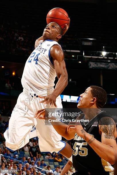 Eric Bledsoe of the Kentucky Wildcats dunks the ball over Tony woods of the Wake Forest Demon Deacons during the second round of the 2010 NCAA men's...