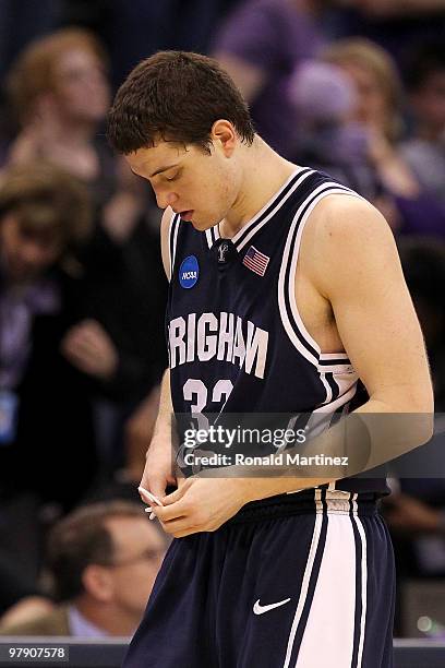 Jimmer Fredette of the Brigham Young Cougars walks off the court dejected against the Kansas State Wildcats during the second round of the 2010 NCAA...