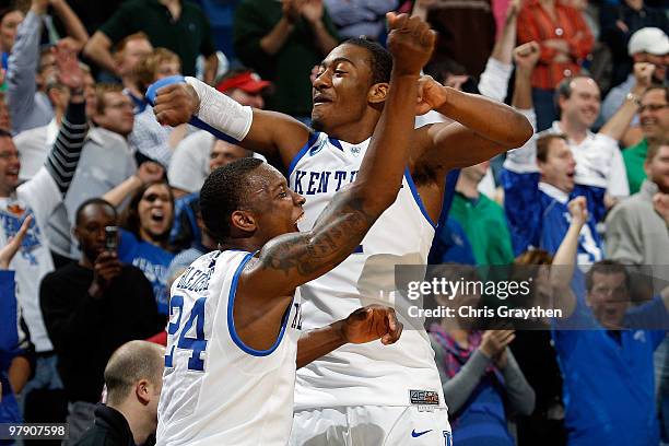 Eric Bledsoe and John Wall of the Kentucky Wildcats celebrate at the end of the game against the Wake Forest Demon Deacons during the second round of...