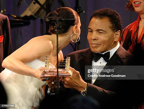 Auto racing driver Danica Patrick, Muhammad Ali, and Lonnie Ali speak onstage during Celebrity Fight Night XVI on March 20, 2010 at the JW Marriott...