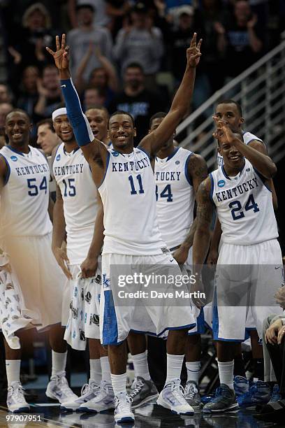 John Wall, Patrick Patterson, Demarcus Cousins, DeAndre Liggins and Eric Bledsoe of the Kentucky Wildcats react to their 90-60 win over the Wake...