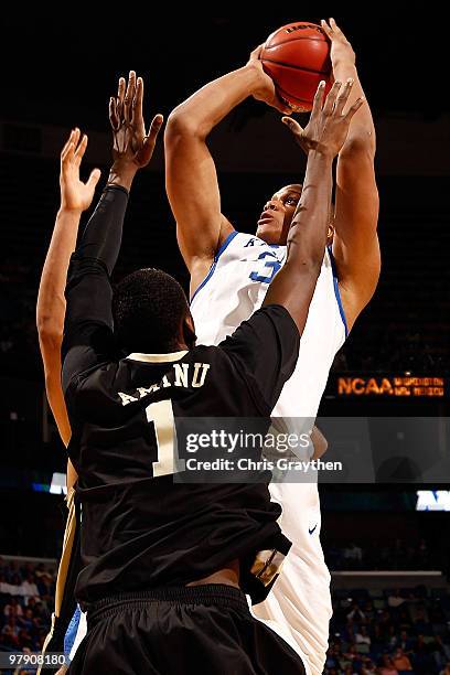Darnell Dodson of the Kentucky Wildcats shoots the ball over Al-Farouq Aminu of the Wake Forest Demon Deacons during the second round of the 2010...
