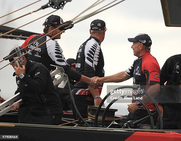 Emirates Team New Zealand Skipper Dean Barker shakes hands with CEO Grant Dalton after they crossed the line ahead of Mascalzone Latino Audi Team...