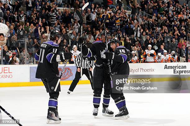 Anze Kopitar, Wayne Simmonds, and Brad Richardson of the Los Angeles Kings celebrate a goal during the first period of their game against the New...