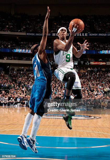 Rajon Rondo of the Boston Celtics goes in for the layup against Jason Terry of the Dallas Mavericks during a game at the American Airlines Center on...