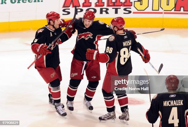 Ed Jovanovski, Wojtek Wolski and Lee Stempniak of the Phoenix Coyotes celebrate Stempniak's third period goal against the Chicago Blackhawks on March...