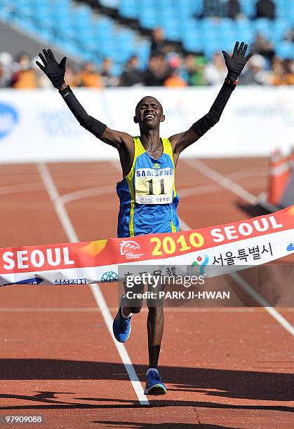 Sylvester Teimet of Kenya crosses the finish line during the men's race of the Seoul International Marathon and the 81th Dong-A Marathon at Olympic...