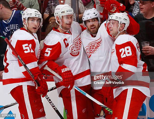 Henrik Zetterberg of the Detroit Red Wings celebrates his overtime winning goal with teammates Valtteri Filppula, Nicklas Lidstrom and Brian Rafalski...