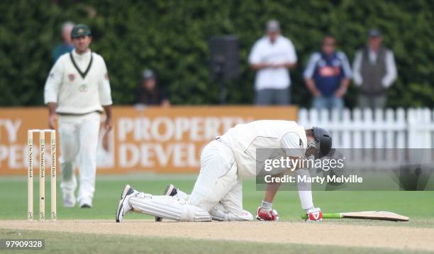 Daniel Vettori captain of New Zealand gets hit by the ball during day three of the First Test match between New Zealand and Australia at Westpac...