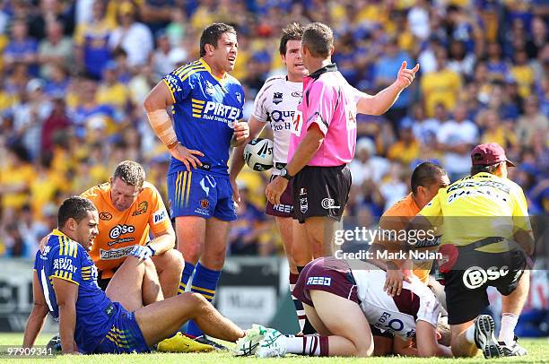 Nathan Cayless of the Eels and Jamie Lyon of the Sea Eagles speak with referee Shayne Hayne as Jarryd Hayne of the Eels and Ben Farrar of the Sea...