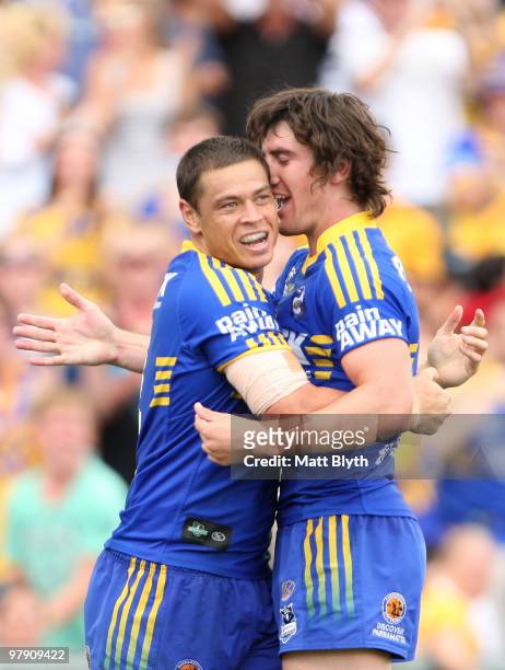 Timana Tahu of the Eels celebrates with team mate Joel Reddy after scoring a try during the round two NRL match between the Parramatta Eels and the...