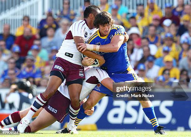 Nathan Hindmarsh of the Eels is tackled during the round two NRL match between the Parramatta Eels and the Manly Sea Eagles at Parramatta Stadium on...