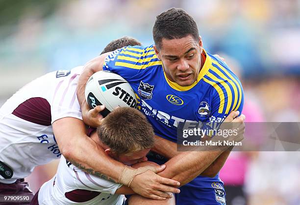 Jarryd Hayne of the Eelsis tackled during the round two NRL match between the Parramatta Eels and the Manly Sea Eagles at Parramatta Stadium on March...