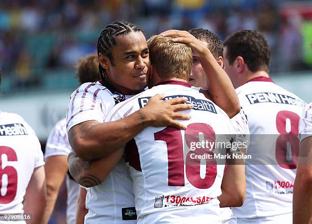 Trent Hodkinson of the Sea Eagles is congratulated by Steve Matai after he scored during the round two NRL match between the Parramatta Eels and the...