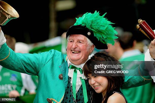 Spectator poses for a photograph with the City of Sydney Town Crier, Graham Keating , during the Sydney St Patrick's Day Parade on March 21 the...