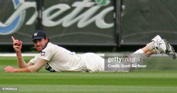 John Hastings of the Bushrangers gestures after taking a diving catch in the outfiled to dismiss Ben Cutting of the Bulls during day five of the...
