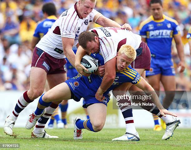 Kris Keating of the eels is tackled during the round two NRL match between the Parramatta Eels and the Manly Sea Eagles at Parramatta Stadium on...