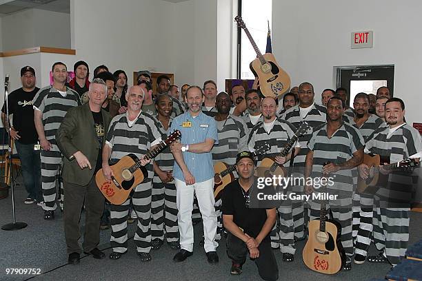 Musician/vocalists Billy Bragg , Wayne Kramer and Tom Morello pose with the inmates during the South By Southwest Music Festival at the Travis County...