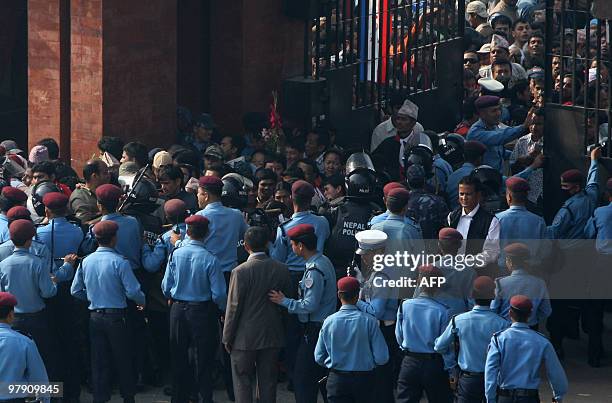 Nepali police attempt to control the crowd trying to enter Dasrath Stadium to view and pay their last respects to former prime minister and Nepali...