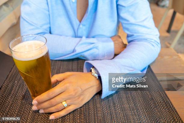 woman with a glass with frothy beer - lager stock pictures, royalty-free photos & images