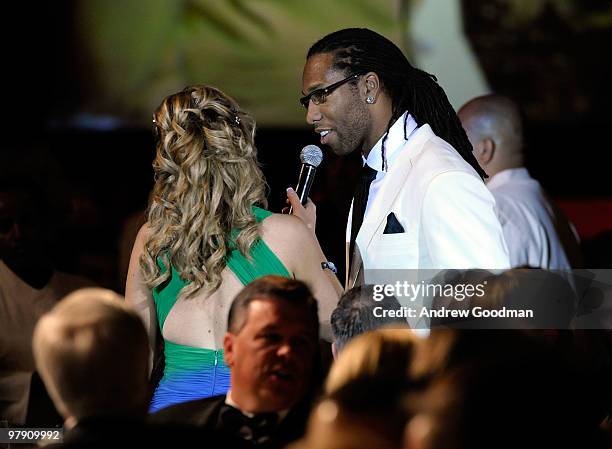 Tara Hitchcock and Larry Fitzgerald speak at Celebrity Fight Night XVI on March 20, 2010 at the JW Marriott Desert Ridge in Phoenix, Arizona.